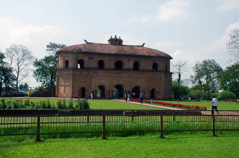 The oval two-storeyed Rang Ghar royal pavilion near Sibsagar, with arched ground floor and carved roof finials