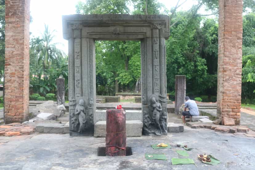 Carved stone doorframe at Da Parbatia, with river-goddess figures at the base of the jambs