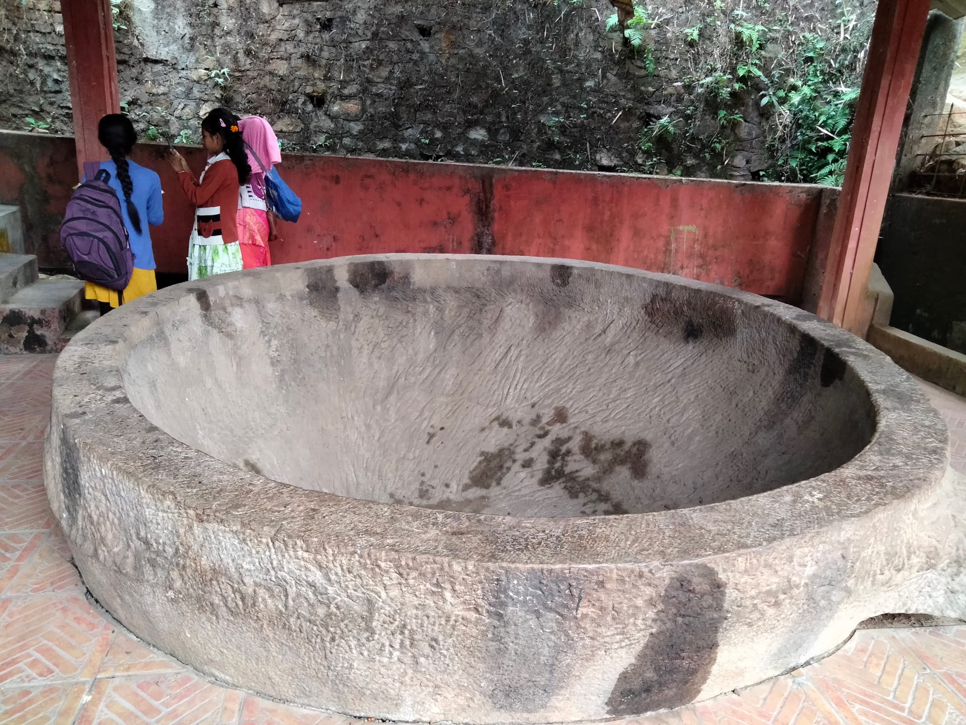 Large chiselled stone basin known as Bhimar Charia under a shelter at Hajo, Assam
